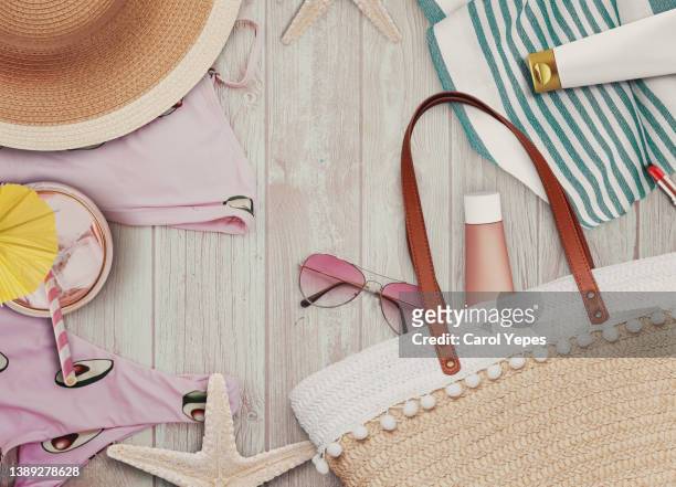 stylish feminine flat lay table top still life. with headphones, summer items and beauty products - accessoires fotografías e imágenes de stock