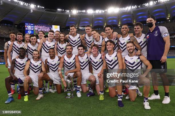 The Dockers pose with the Western Derby trophy after winning the round three AFL match between the West Coast Eagles and the Fremantle Dockers at...