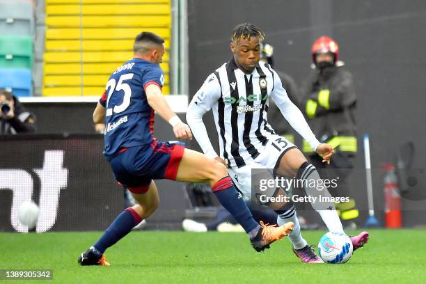 Gabriele Zappa of Cagliari Calcio competes for the ball with Destiny Udogie of Udinese Calcio during the Serie A match between Udinese Calcio and...