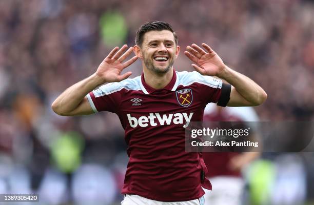Aaron Cresswell of West Ham United celebrates after scoring their side's first goal from a free kick during the Premier League match between West Ham...