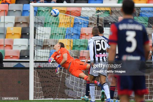 Rodrigo Becao of Udinese Calcio scores his team's first goal during the Serie A match between Udinese Calcio and Cagliari Calcio at Dacia Arena on...