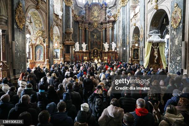 People gather at the Church of the Most Holy Apostles Peter and Paul prayed for the war to end at Sunday service on April 3, 2022 Lviv, Ukraine.