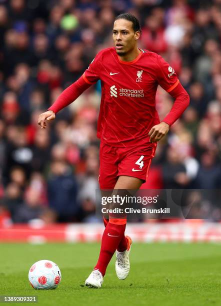 Virgil van Dijk of Liverpool runs with the ball during the Premier League match between Liverpool and Watford at Anfield on April 02, 2022 in...