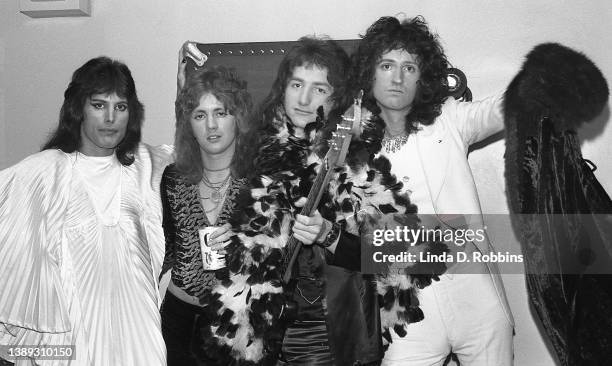 During a run of May 1974 shows as support act for Mott the Hoople at the Uris Theatre in midtown Manhattan, New York City, Queen poses backstage, May...
