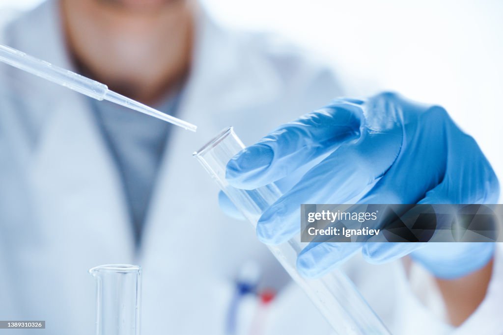 Microbiological research with a test tube and micropipette in close -up