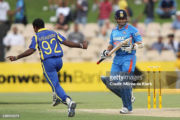 Sachin Tendulkar of India walks off after getting out as the bowler Nuwan Kulasekara of Sri Lanka celebrates during the One Day International match...