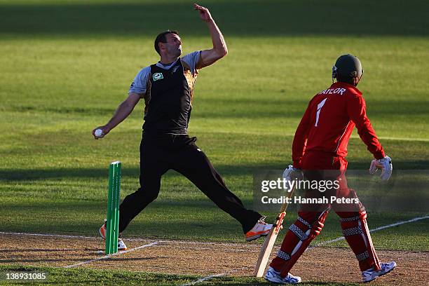 Andrew Ellis of New Zealand bowls during the second International Twenty20 match between New Zealand and Zimbabawe at Seddon Park on February 14,...