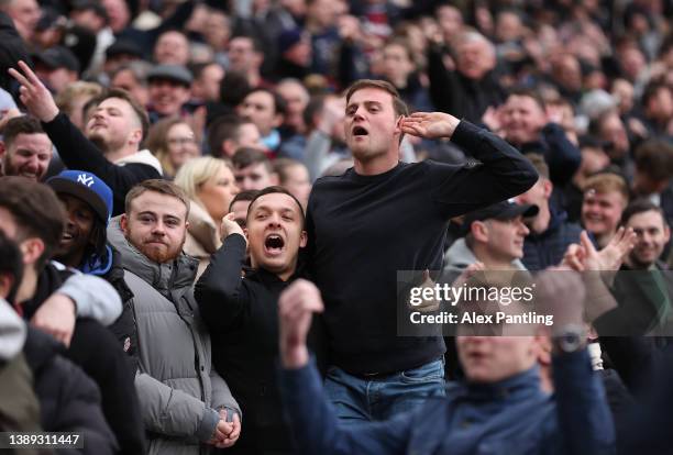 West Ham United fans gesture during the Premier League match between West Ham United and Everton at London Stadium on April 03, 2022 in London,...