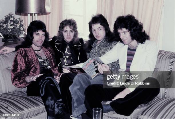 In New York for a series of shows at the Uris Theater, Queen pose in their hotel room with an issue of Creem magazine, May 1974. Singer Freddie...
