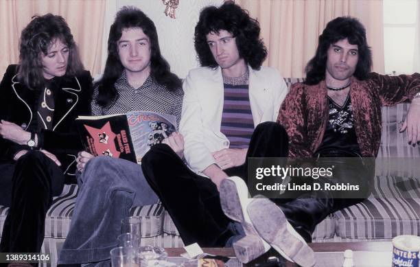 In New York for a series of shows at the Uris Theater, Queen pose in their hotel room with an issue of Creem magazine, may 1974. Drummer Roger...
