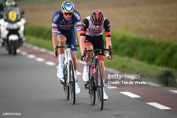 Mathieu Van Der Poel of Netherlands and Team Alpecin-Fenix and Tadej Pogacar of Slovenia and UAE Team Emirates compete during the 106th Ronde van...