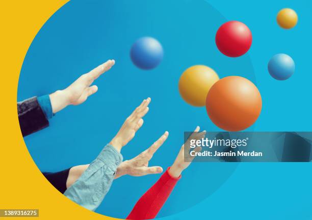 people hands and colourful spheres up - relazione umana foto e immagini stock