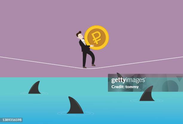 businessman holds a russian ruble coin and walking on a rope with a shark in the sea - silver shark stock illustrations