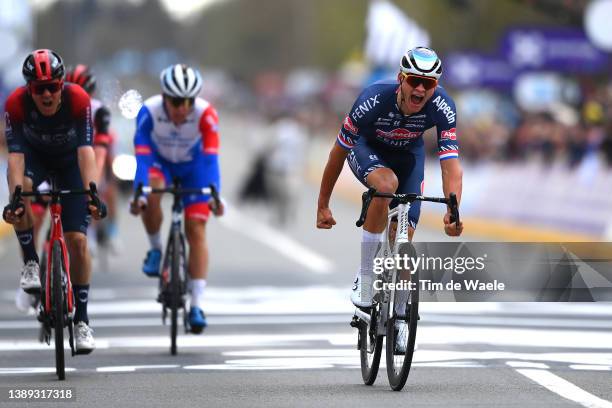 Mathieu Van Der Poel of Netherlands and Team Alpecin-Fenix celebrates at finish line as race winner ahead of Dylan Van Baarle of Netherlands and Team...