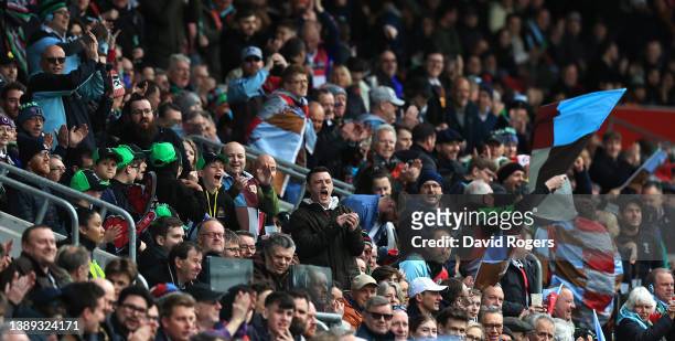 Harlequins fans celebrate during the Gallagher Premiership Rugby match between London Irish and Harlequins at Brentford Community Stadium on April...