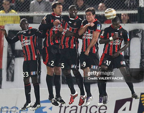 Nice's Drissa Diakite, Renato Civelli, Kevin Gomis, Xavier Pentecote and Franck Dja Djedje try to stop a free kick during their French League...