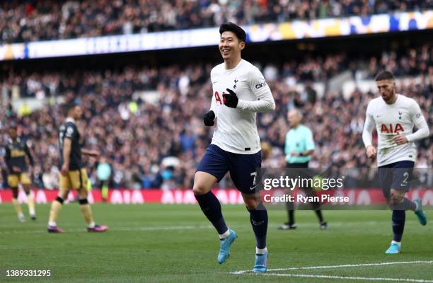 Heung-Min Son of Tottenham Hotspur celebrates after scoring their side's third goal during the Premier League match between Tottenham Hotspur and...