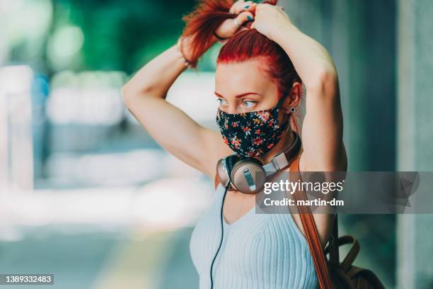 woman with pollen allergy wears protective face mask during the spring season - summer hair bun stock pictures, royalty-free photos & images