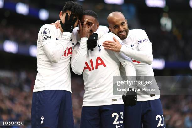 Steven Bergwijn of Tottenham Hotspur celebrates with teammates Heung-Min Son and Lucas Moura after scoring their side's fifth goal during the Premier...