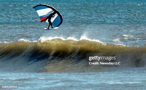 Person windsurfs in Long Beach, New York on April 2, 2022