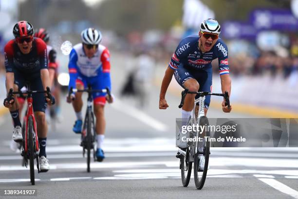 Mathieu Van Der Poel of Netherlands and Team Alpecin-Fenix celebrates at finish line as race winner ahead of Dylan Van Baarle of Netherlands and Team...