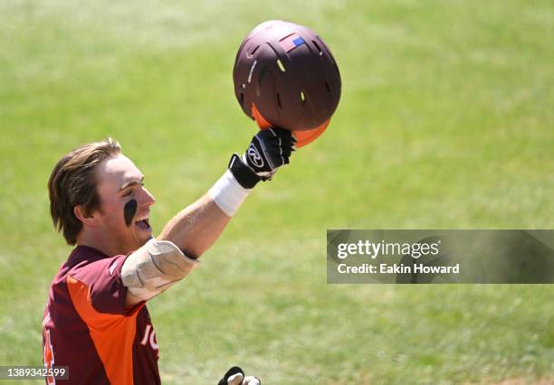 Carson DeMartini of the Virginia Tech Hokies celebrates as he crosses home plate after hitting a home run against the North Carolina Tar Heels during...