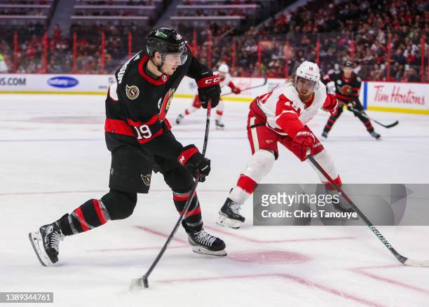 Drake Batherson of the Ottawa Senators winds up to shoot the puck as Marc Staal of the Detroit Red Wings looks on during the second period at...