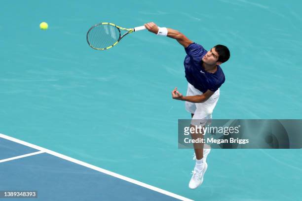Carlos Alcaraz of Spain serves to Casper Ruud of Norway in the men's singles final on day 13 of the Miami Open at Hard Rock Stadium on April 03, 2022...
