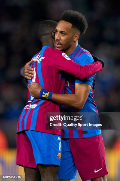 Pierre-Emerick Aubameyang of FC Barcelona greet Ousmane Dembele during the LaLiga Santander match between FC Barcelona and Sevilla FC at Camp Nou on...