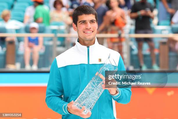 Carlos Alcaraz of Spain poses with the Butch Buchholz Trophy after defeating Casper Ruud of Norway in the Men's Singles final during the Miami Open...