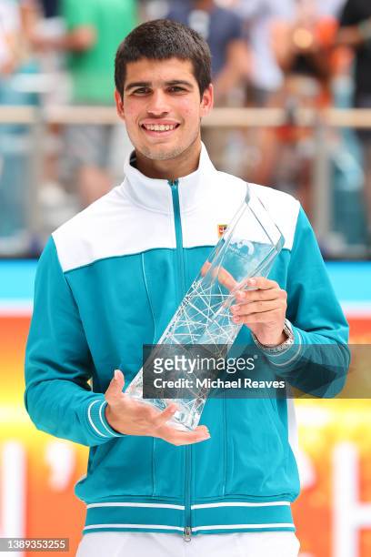 Carlos Alcaraz of Spain poses with the Butch Buchholz Trophy after defeating Casper Ruud of Norway in the Men's Singles final during the Miami Open...