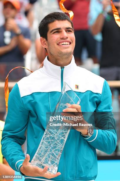 Carlos Alcaraz of Spain poses with the Butch Buchholz Trophy after defeating Casper Ruud of Norway in the Men's Singles final during the Miami Open...