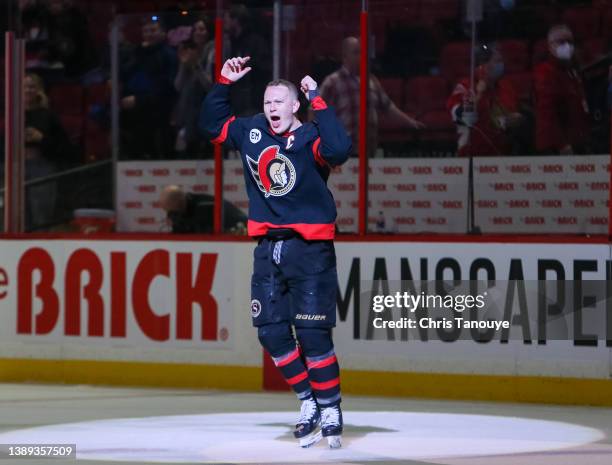 Brady Tkachuk of the Ottawa Senators celebrates after being named the third star following a 5-2 win against the Detroit Red Wings at Canadian Tire...