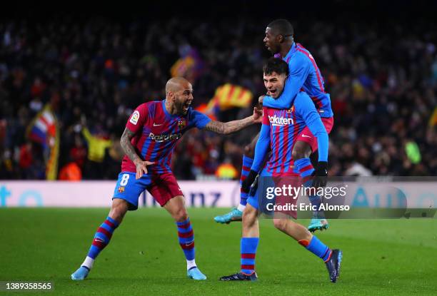 Pedri of FC Barcelona celebrates their sides first goal with team mates Ousmane Dembélé and Dani Alves during the LaLiga Santander match between FC...