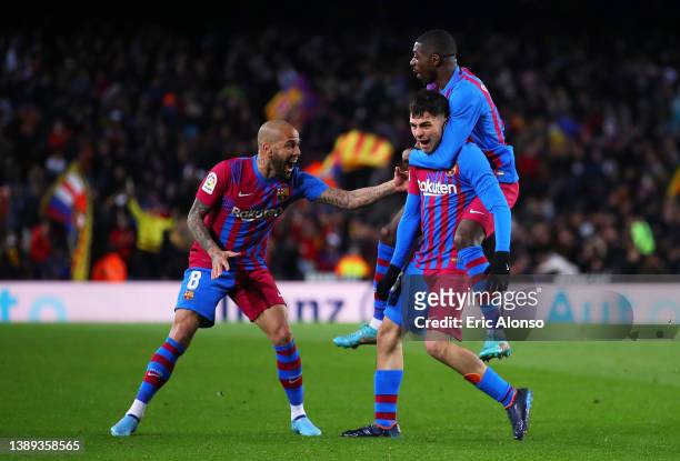 Pedri of FC Barcelona celebrates their sides first goal with team mates Ousmane Dembélé and Dani Alves during the LaLiga Santander match between FC...