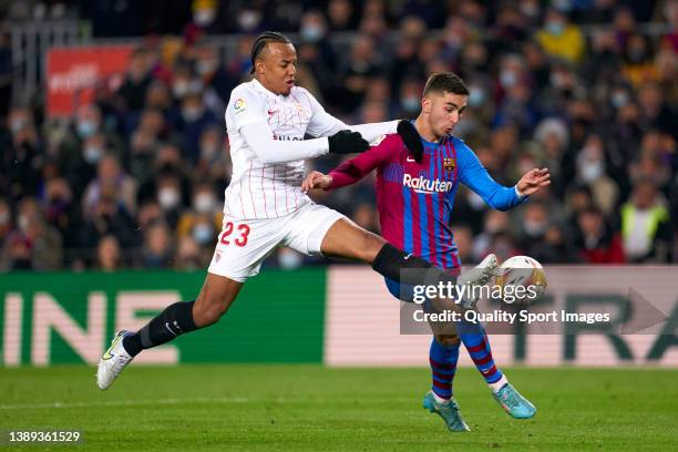 Ferran Torres of FC Barcelona competes for the ball with Jules Kounde of Sevilla FC during the LaLiga Santander match between FC Barcelona and...