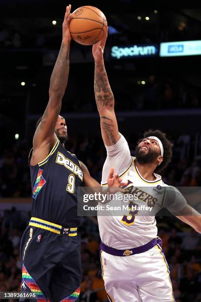 Anthony Davis of the Los Angeles Lakers blocks a shot by Davon Reed of the Denver Nuggets during the first half of a game at Crypto.com Arena on...