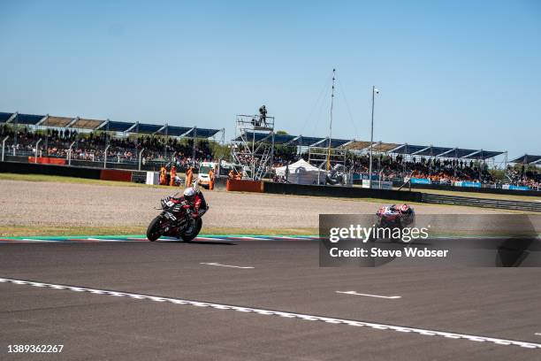 Aleix Espargaro of Spain and Aprilia Racing wins the race in front of Jorge Martin of Spain and Pramac Racing during the MotoGP race of Argentina at...