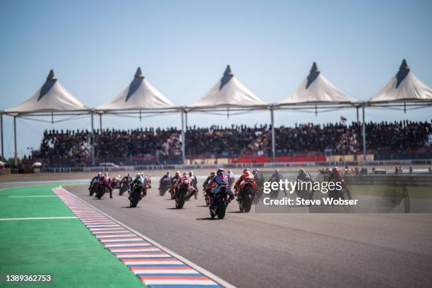 MotoGP riders braking into turn one after the race start during the MotoGP race of Argentina at the Autódromo Termas de Río Hondo on April 03, 2022...