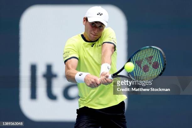 Casper Ruud of Norway returns a shot to Carlos Alcaraz of Spain during the men's final of the Miami Open at Hard Rock Stadium on April 03, 2022 in...