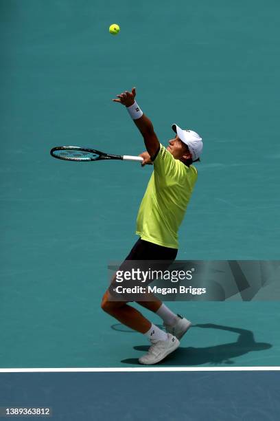 Casper Ruud of Norway serves to Carlos Alcaraz of Spain in the men's singles final on day 13 of the Miami Open at Hard Rock Stadium on April 03, 2022...