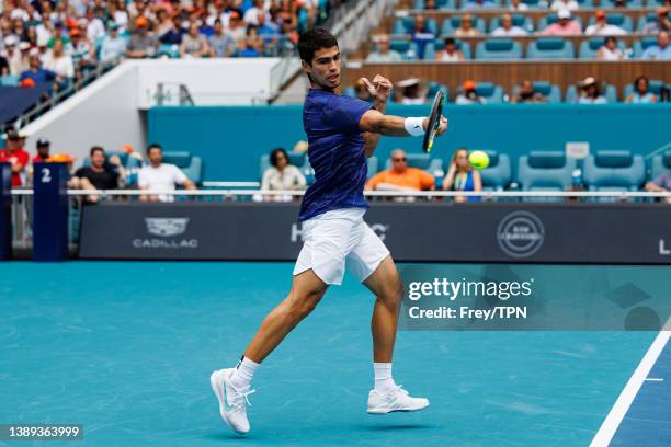 Carlos Alcaraz of Spain hits a forehand Casper Ruud of Norway in the men's final of the Miami Open at the Hard Rock Stadium on April 03, 2022 in...