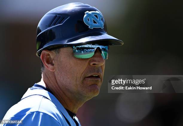 Head coach Scott Forbes of the North Carolina Tar Heels looks into the dugout against Virginia Tech Hokies during the third inning at Boshamer...