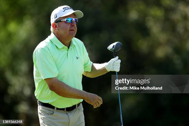 Billy Mayfair of the United States watches his tee shot on the first hole during the final round of the Rapiscan Systems Classic at Grand Bear Golf...