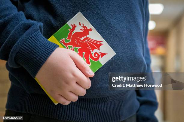 Child holds a Welsh book in a school on March 23, 2022 in Cardiff, Wales.