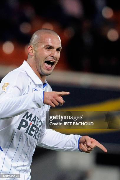 Auxerre's Israeli midfielder Ben Sahar celebrates after scoring a goal during the French League Cup football match Auxerre vs Caen, on October 2011...