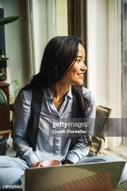 young asian woman by the window - makeup smile laugh closeup female stock pictures, royalty-free photos & images