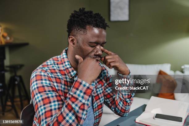 young guy had a stressful day - winter blues stock pictures, royalty-free photos & images