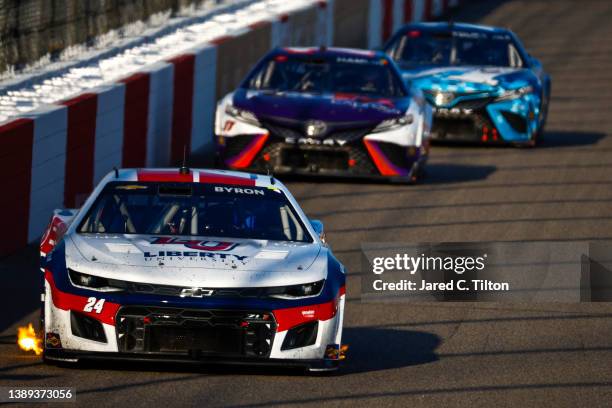 William Byron, driver of the Liberty University Chevrolet, drives with flames during the NASCAR Cup Series Toyota Owners 400 at Richmond Raceway on...