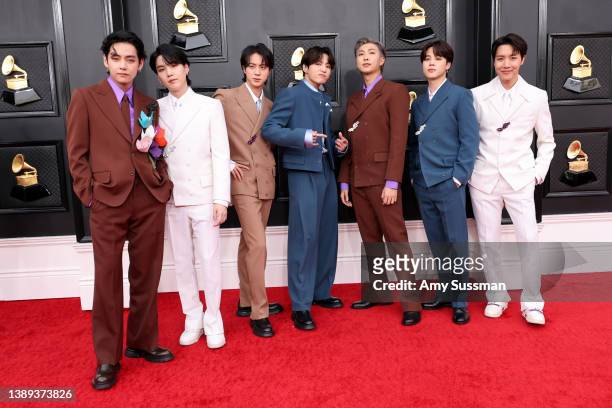 Suga, Jin, Jungkook, RM, Jimin and J-Hope of BTS attend the 64th Annual GRAMMY Awards at MGM Grand Garden Arena on April 03, 2022 in Las Vegas,...